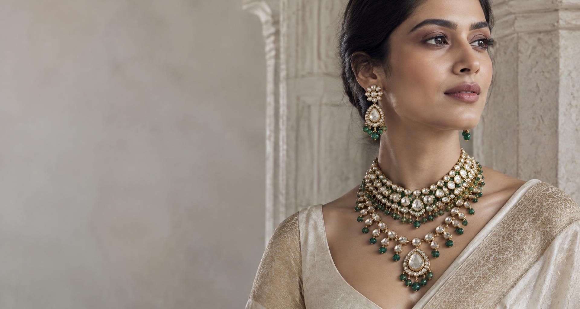 Indian jewellery portrait featuring an emerald and polki-inspired necklace and earrings